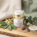 Cosmetic cream jar with natural elements on a wooden surface