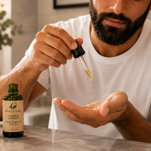 Man holding a dropper with a bottle of Grown & Wild Company product on a counter.